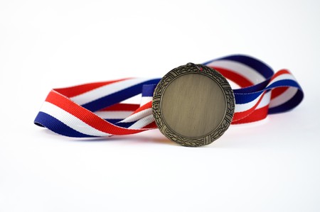 Shiny medalion with a red, white and blue ribbon