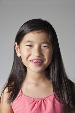 pretty smiling Chinese girl with new braces Reklamní fotografie