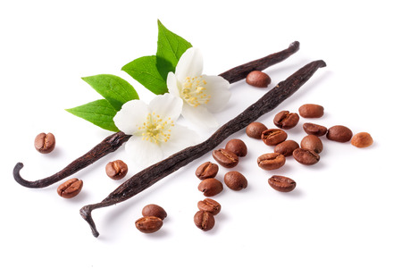 Vanilla sticks and coffee beans with flower isolated on white background.