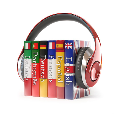 dictionaries with headphones, learning foreign language Stock Photo