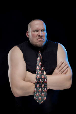 Emotional comic actor gesturing man in a tie on a black background, Christmas and New Year Stock Photo