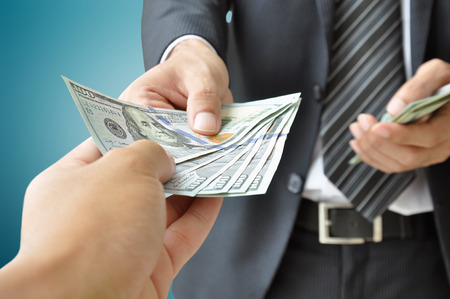 Hand receiving money from businessman - United States dollar (USD) bills - 30445796