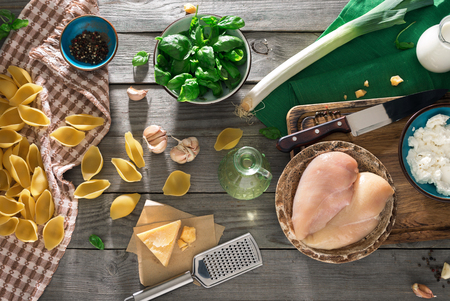 Raw Ingredients For Cooking Italian Pasta On Wooden Table Top View Rustic Style Photo Raw Ingredients For Cooking Italian Pasta On Wooden Table Top View Rustic Style Photo