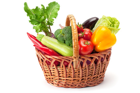 fresh and ripe vegetables arranged in a basket isolated on white - 53816305