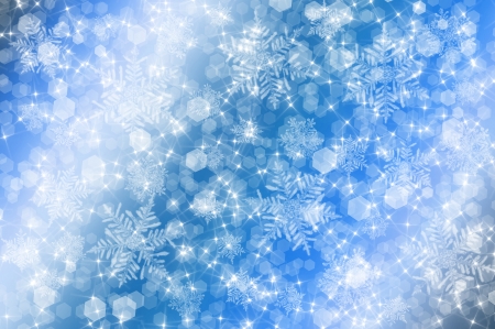 Blue christmas background with bokeh circles and white snowflakes Imagens