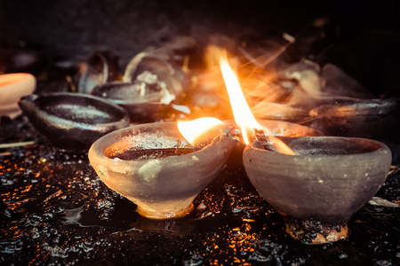 Burning oil lamps at temple traditional offering in buddhist and hindu temple Stock Photo