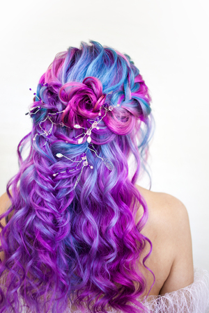124797972-stylish-fashionable-young-woman-with-bright-hair-coloring-magenta-and-purple-beautiful-curls-stylish.jpg