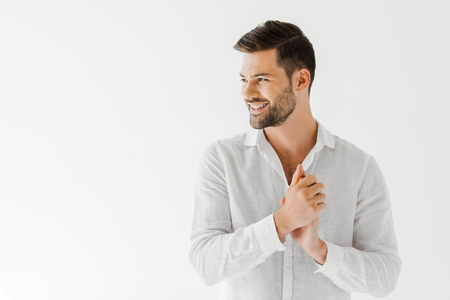 side view of smiling man in linen white shirt isolated on grey background - 109488784