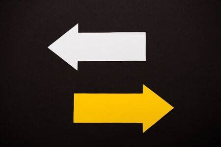 top view of directional arrows showing left and right isolated on black Stock Photo