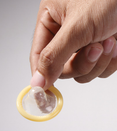 stock image of the man holding condom - 118512087