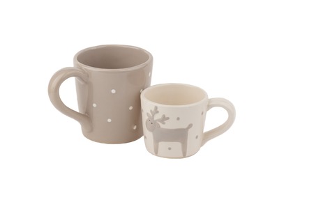 Beige ceramic cups for coffee or tea on the white background