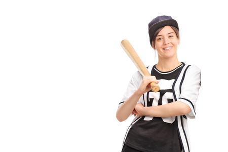 野球のユニフォーム バットを押し 白い背景で隔離壁にもたれての若い女性 の写真素材 画像素材 Image