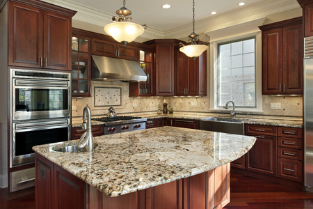 Kitchen with granite island and cherry wood cabinetry - 50031171