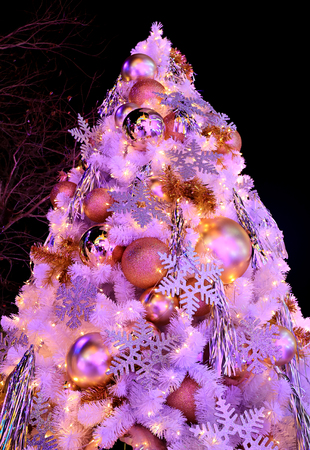 pink colored light up big christmas tree full of glitter and shiny ornaments stock photo - Big Christmas Ornaments pink colored light up big christmas tree full of glitter and shiny ornaments stock photo - Big Christmas Ornaments