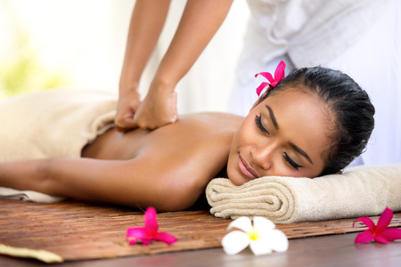 Massage: Балийский массаж в спа-среде, глубокий массаж спины Фото со стока
