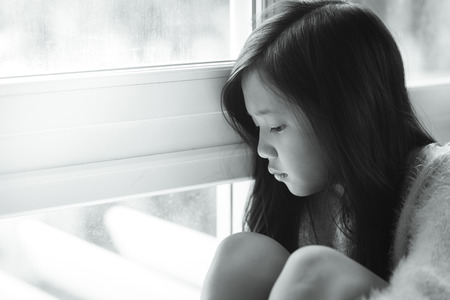 sad lonely: Portrait of asian beautiful sad girl at the window,vintage filter