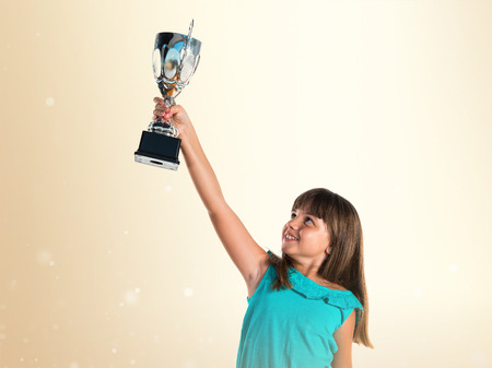 Young girl holding a trophy Stock Photo