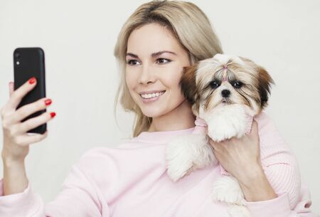 Girl Takes Selfie With Shih Tzu Puppy Posing On The Phone