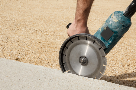 Worker Hand Holding Angle Grinder With Diamond Cutting Disc For Concrete Ready To Saw A Cement Slab Space For Text Stock Photo Picture And Royalty Free Image Image 83559454