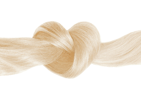 Blond hair knot in shape of heart, isolated on white Banco de Imagens