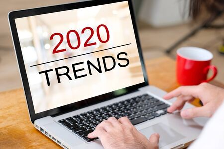 2020 Digital Trends, Man Hand Tying Laptop Computer With 2020 Trends On Screen Background, Digital Marketing, Business And Technology Concept