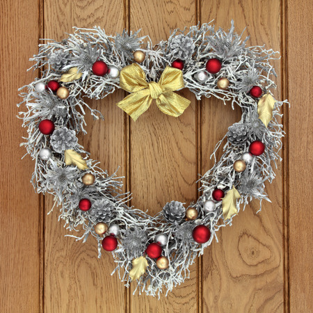 heart shaped christmas wreath with red gold and silver bauble decorations over old oak background - Red Gold And Silver Christmas Decorations heart shaped christmas wreath with red gold and silver bauble decorations over old oak background - Red Gold And Silver Christmas Decorations