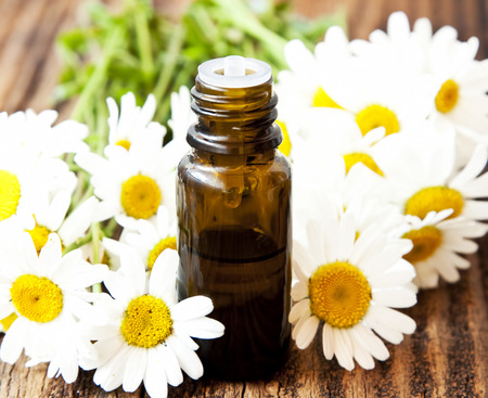 Chamomile Essential Oil Bottle with Flowers