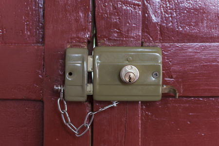 Old Lock Locked With Its Chain Seen From Inside An Old Door Painted ... Old Lock Locked With Its Chain Seen From Inside An Old Door Painted ...