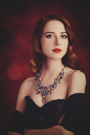 Portrait Of A Beautiful Girl In Retro Corset And Nakelace On Red Background Stock Photo Portrait Of A Beautiful Girl In Retro Corset And Nakelace On Red Background Stock Photo