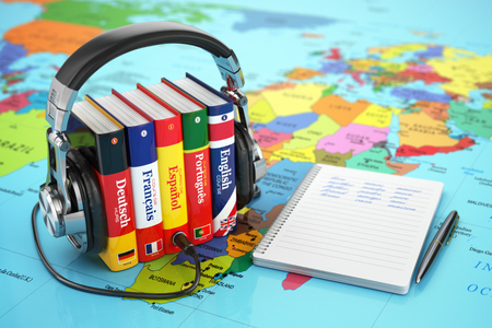 Learning languages online. Audiobooks concept. Books and headphones on the map world. 3d - 48592459