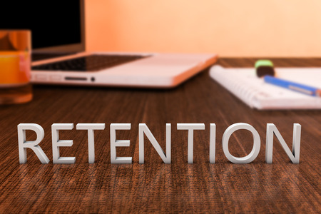 retention letters on wooden desk with laptop computer and a