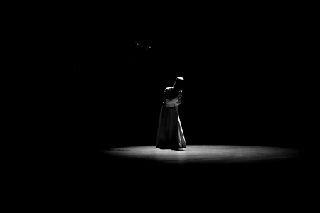 The image of a whirling dervish in the darkness