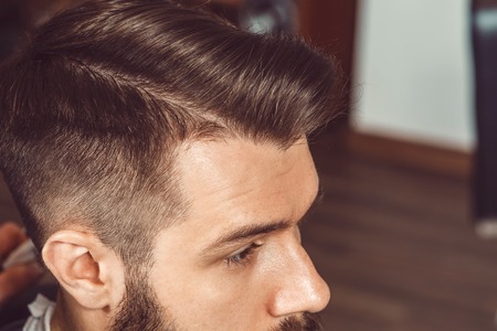 the profile of young man with a trendy hairstyles stock photo
