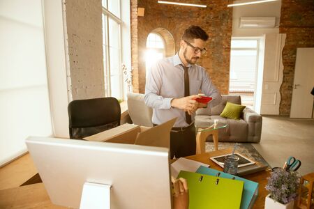 Beginning A Young Businessman Moving In The Office Getting New
