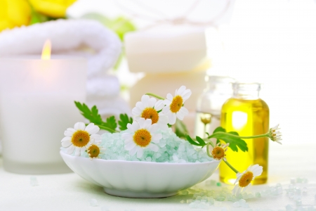 Spa relaxation theme with flowers, bath salt, essential oil, towels and candles - 18222179