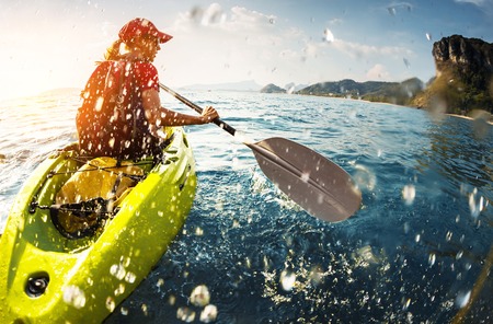 young lady paddling the kayak stock photo picture and royalty free