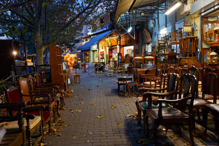 Antique Furniture Shop In The Flea Market In The Monastiraki.. Stock Antique furniture shop in the flea market in the Monastiraki area in Plaka, Athens Stock - Antique Furniture Shop In The Flea Market In The Monastiraki.. Stock