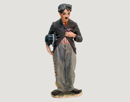 Old statuette of Charlie Chaplin with a stick in his hands