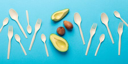 Say no to plastic, save the planet. Eco plastic of avocado seeds isolated on blue background, panorama 스톡 콘텐츠 - 137092335