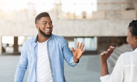 African American Guy And Girl Waving Hands Greeting Each Other