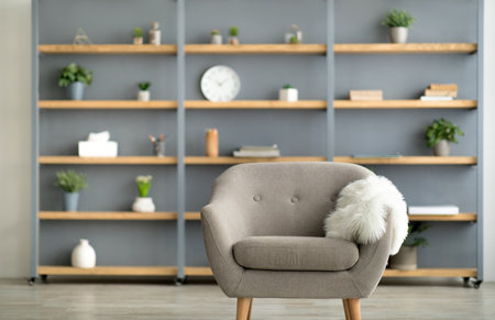 Blog About Interiors, Stylish, Minimalist, Scandinavian And Retro Design. Gray Armchair, Shelf With Books, Accessories, Decor Elements And Plants In Pots In Cozy Living Room Interior, Flat Lay