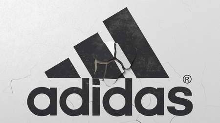 Destroying wall with painted logo of Adidas. Crisis conceptual editorial 3D rendering - 120226860