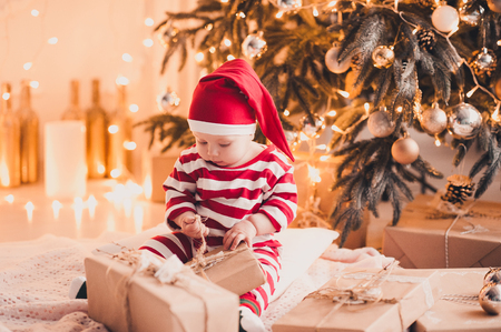 cute baby girl 1 year old open christmas presents sitting on floor under christmas tree in - Christmas Presents For 1 Year Old cute baby girl 1 year old open christmas presents sitting on floor under christmas tree in - Christmas Presents For 1 Year Old