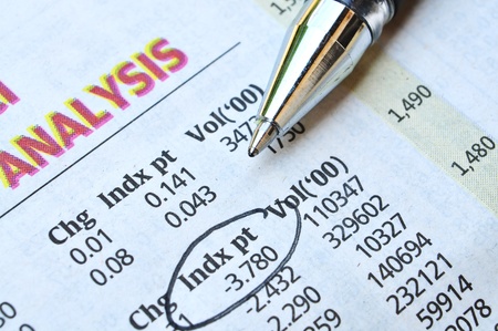 economic analysis on newspaper and pointing numbers by ballpen Stock Photo - 10332636 economic analysis on newspaper and pointing numbers by ballpen Stock Photo - 10332636