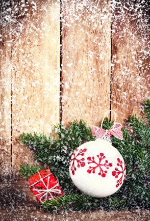 christmas ornaments with fir tree branch over wood wall with falling snow vintage christmas card - Christmas Card Ornaments christmas ornaments with fir tree branch over wood wall with falling snow vintage christmas card - Christmas Card Ornaments