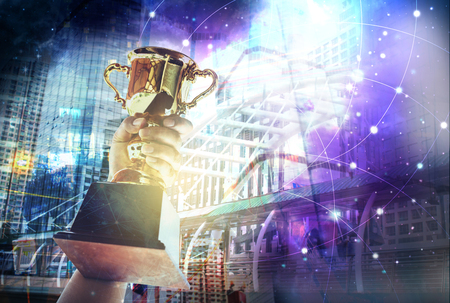Win concept,man holding up a gold trophy cup is winner in a competition with global network internet concept.