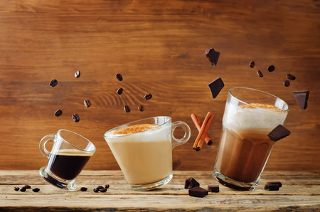 Different Types Of Coffee With Flying Ingredients Espresso Cappuccino And Mocha Toning Different Types Of Coffee With Flying Ingredients Espresso Cappuccino And Mocha Toning
