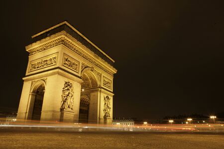 arc de triomphe at night with cars driving by stock photo picture