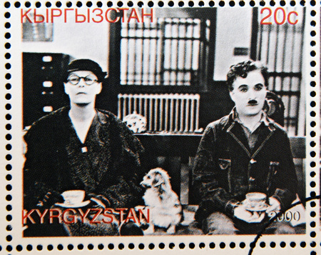 KYRGYZSTAN - CIRCA 2000: A stamp printed in Kyrgyzstan shows scene from the movie Modern Times by Charles Chaplin, circa 2000 Editorial