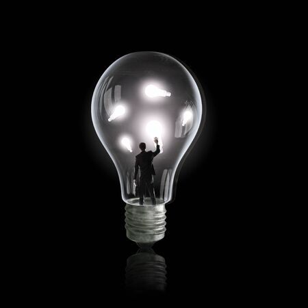 man holding luminous idea inside light bulb stock photo picture and